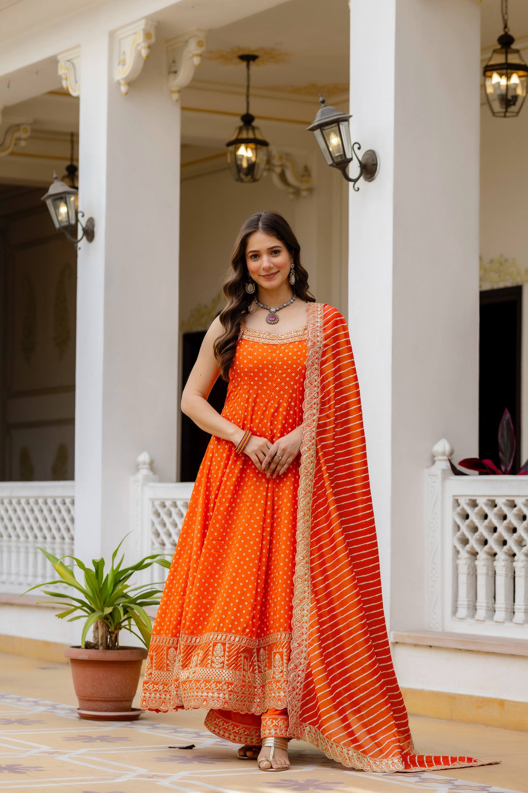 Bright Orange Bandhani Vichitra Silk Embroidered Gown Set with Real Mirror Work & Leheriya Dupatta
