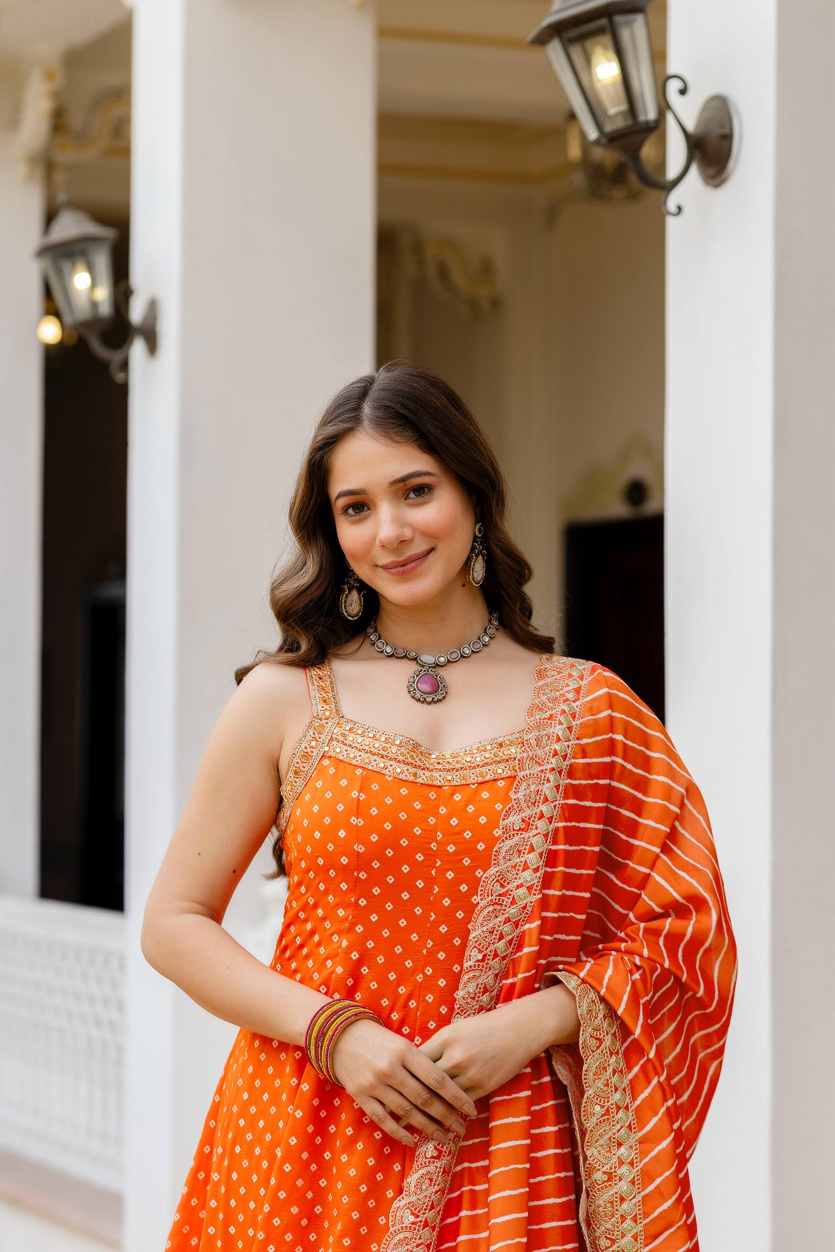 Bright Orange Bandhani Vichitra Silk Embroidered Gown Set with Real Mirror Work & Leheriya Dupatta