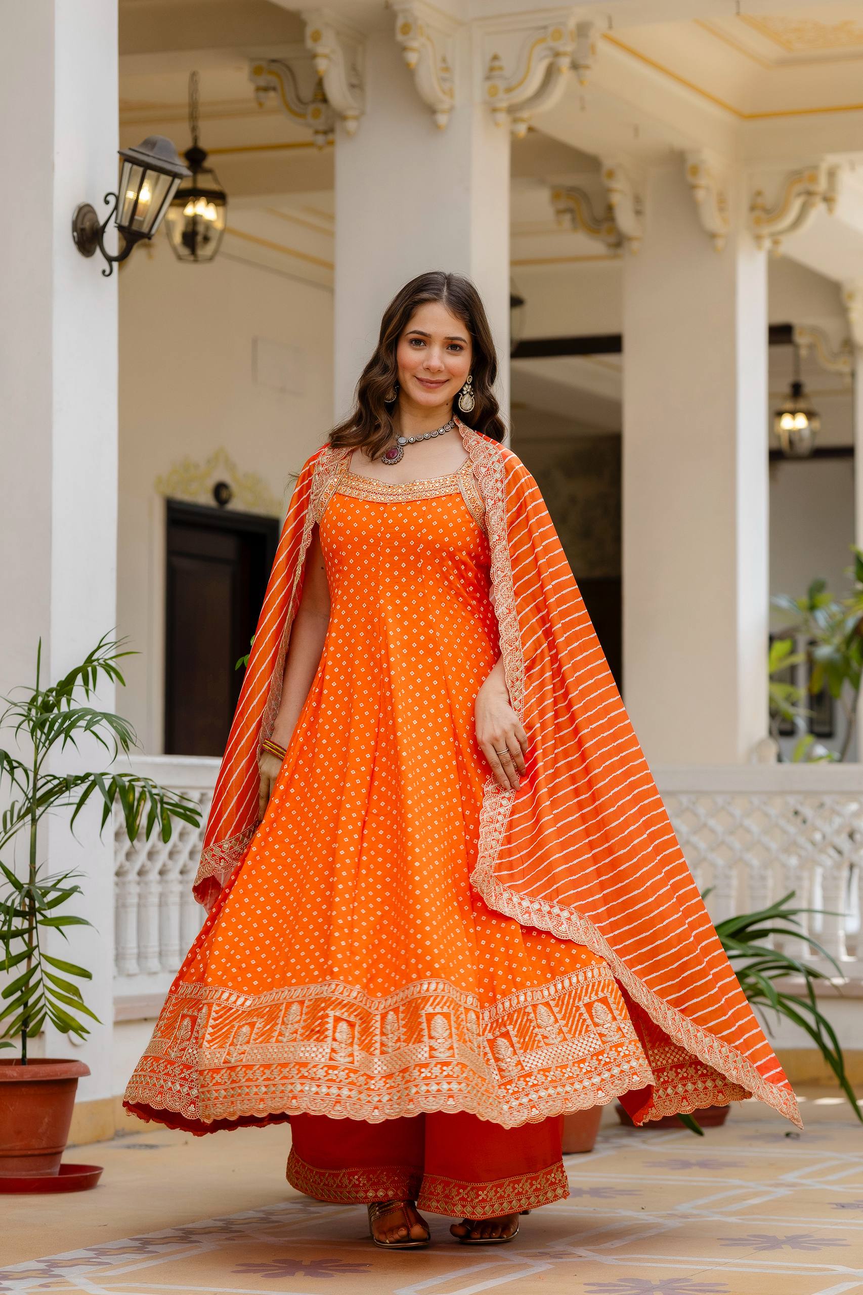 Bright Orange Bandhani Vichitra Silk Embroidered Gown Set with Real Mirror Work & Leheriya Dupatta