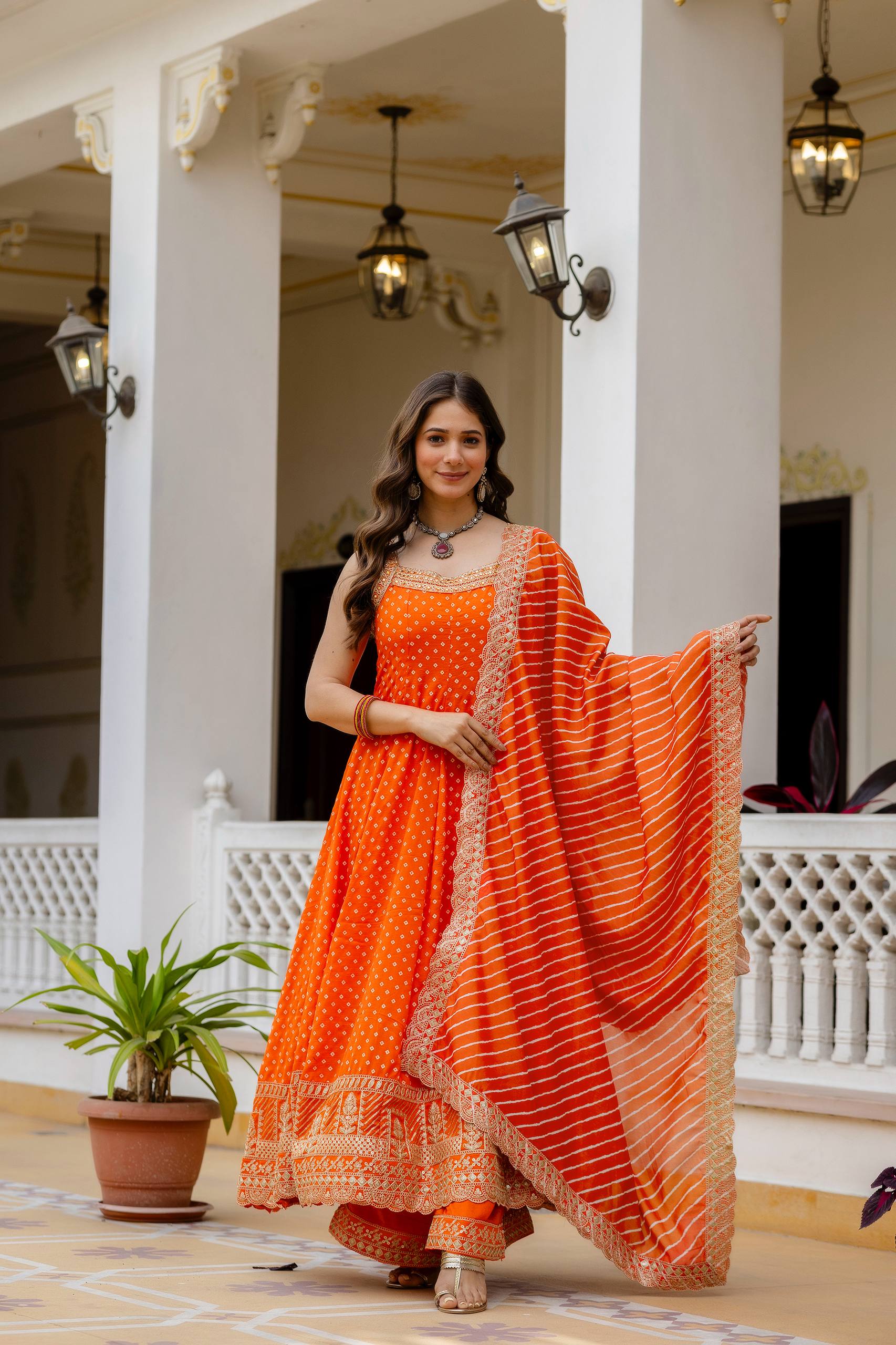 Bright Orange Bandhani Vichitra Silk Embroidered Gown Set with Real Mirror Work & Leheriya Dupatta