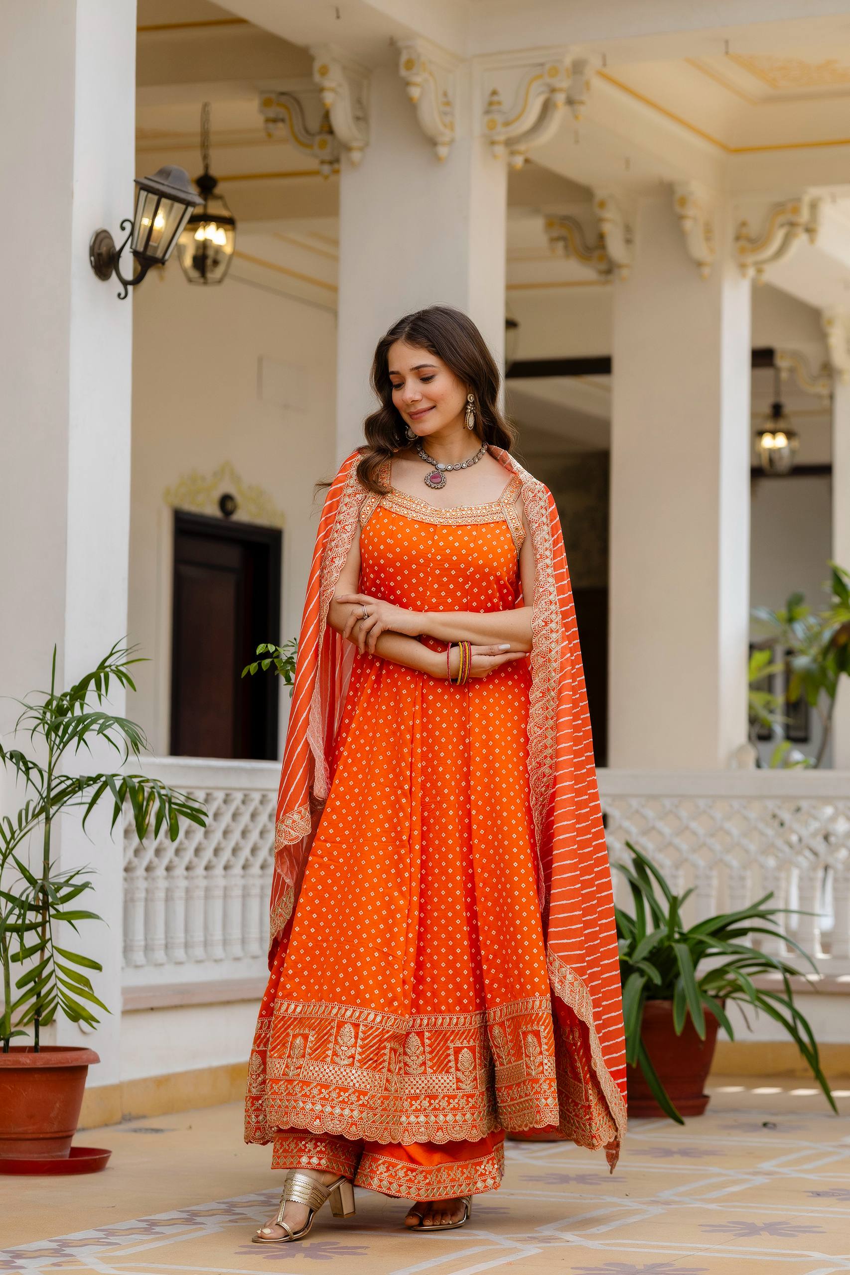 Bright Orange Bandhani Vichitra Silk Embroidered Gown Set with Real Mirror Work & Leheriya Dupatta